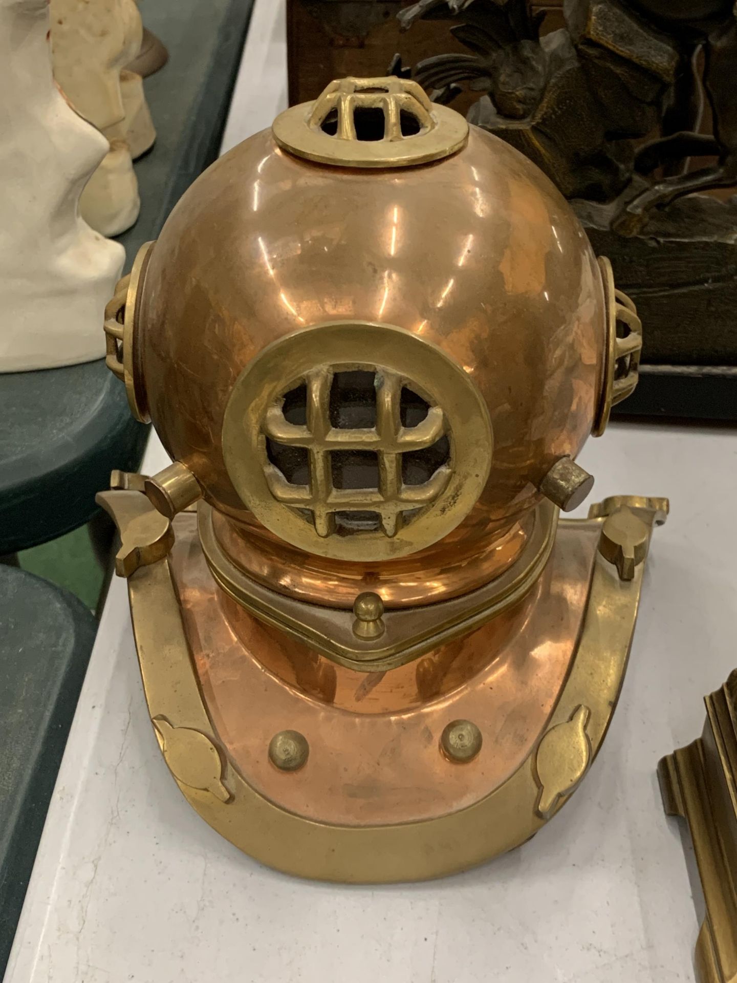A BRASS AND COPPER MODEL OF A DIVERS HELMET, HEIGHT 20CM