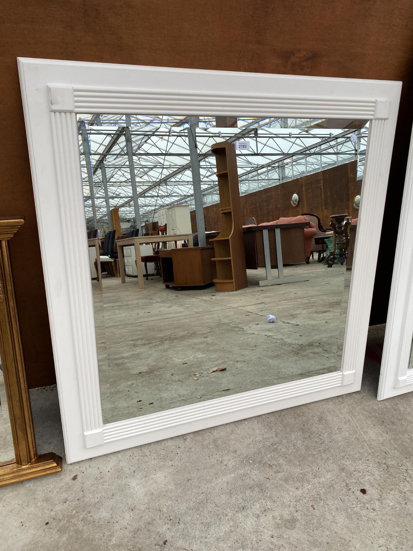 A MODERN WHITE PAINTED BEVEL EDGE WALL MIRROR, 39" SQUARE