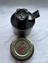 AN AS NEW AND IN A TIN CASIO G SHOCK WATCH WITH TAG SEEN WORKING BUT NO WARRANTY