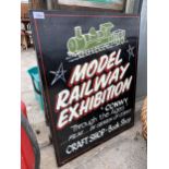 A WOODEN 'MODEL RAILWAY EXHIBITION' SIGN