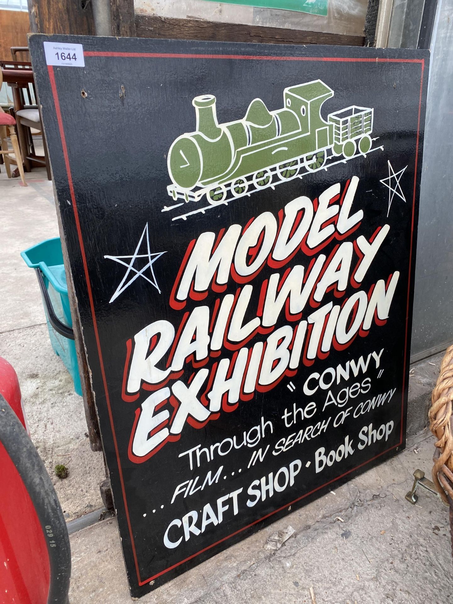 A WOODEN 'MODEL RAILWAY EXHIBITION' SIGN