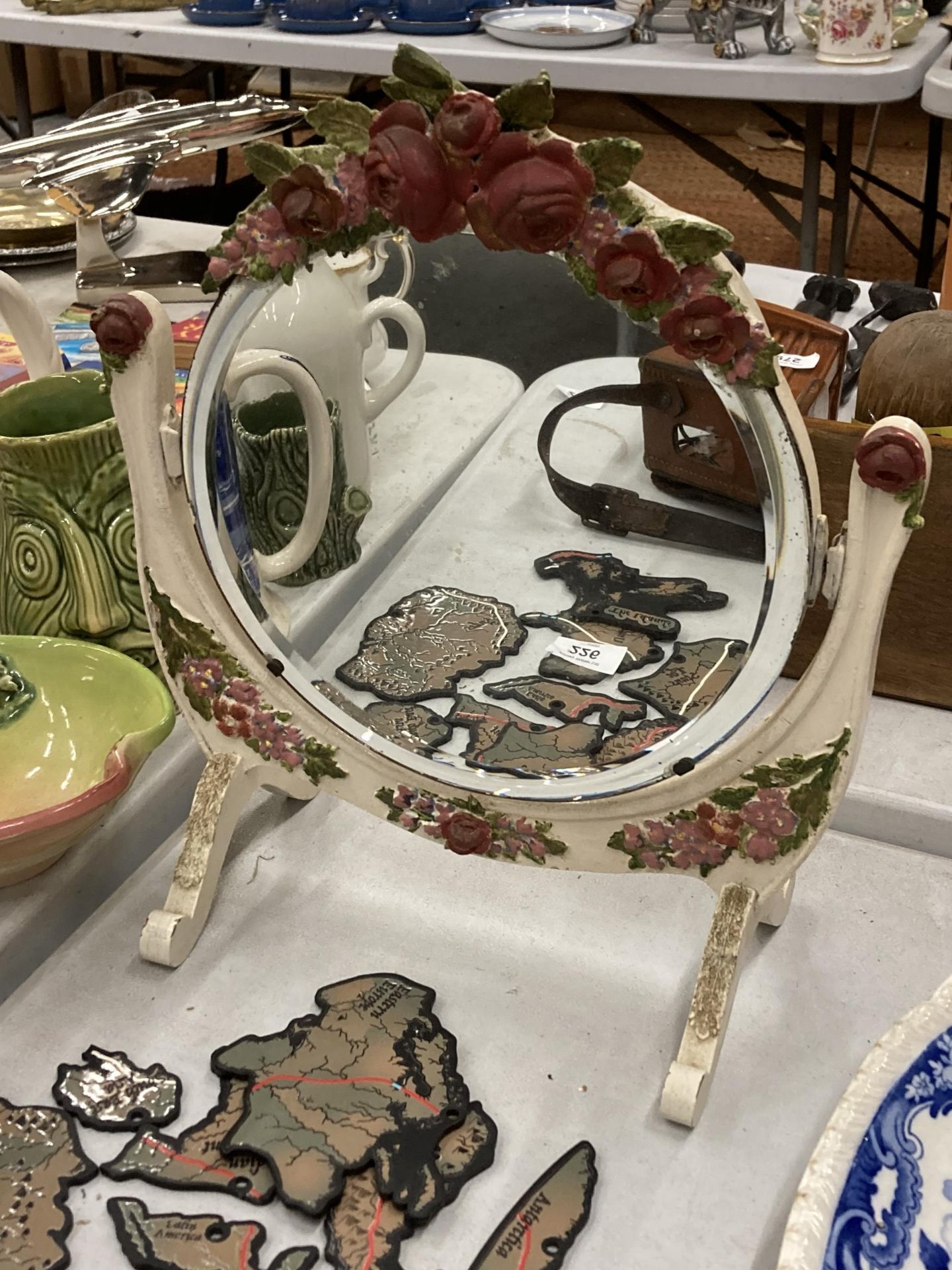 A VINTAGE BARBOLA STYLE MIRROR ON A FLORAL STAND, HEIGHT 34CM