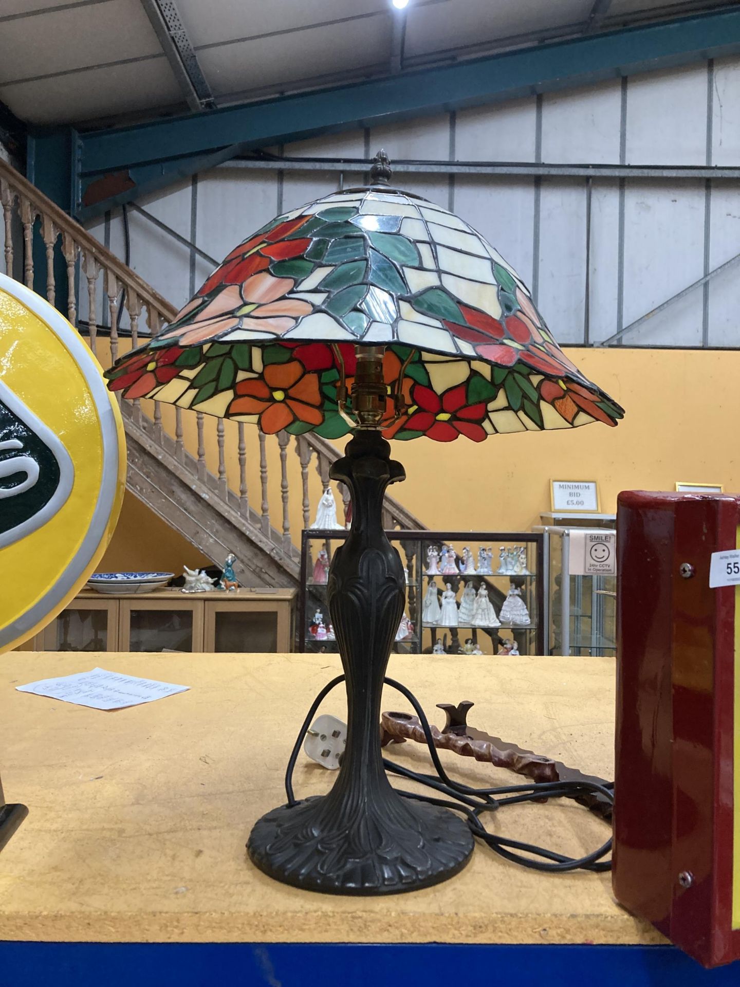 A TIFFANY STYLE TABLE LAMP WITH LEADED GLASS SHADE