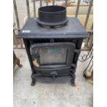 A SMALL CAST IRON LOG BURNER