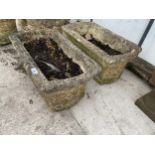 A PAIR OF RECONSTITUTED STONE GARDEN TROUGH PLANTERS