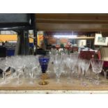 A LARGE QUANTITY OF GLASSES TO INCLUDE WINE, TWO BOHEMIAN, CHAMPAGNE FLUTES, SHERRY, ETC