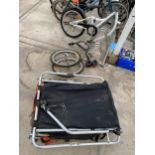A TWO WHEELED BIKE CARRY TRAILER AND A ACHILDS BIKE ATTATCHMENT