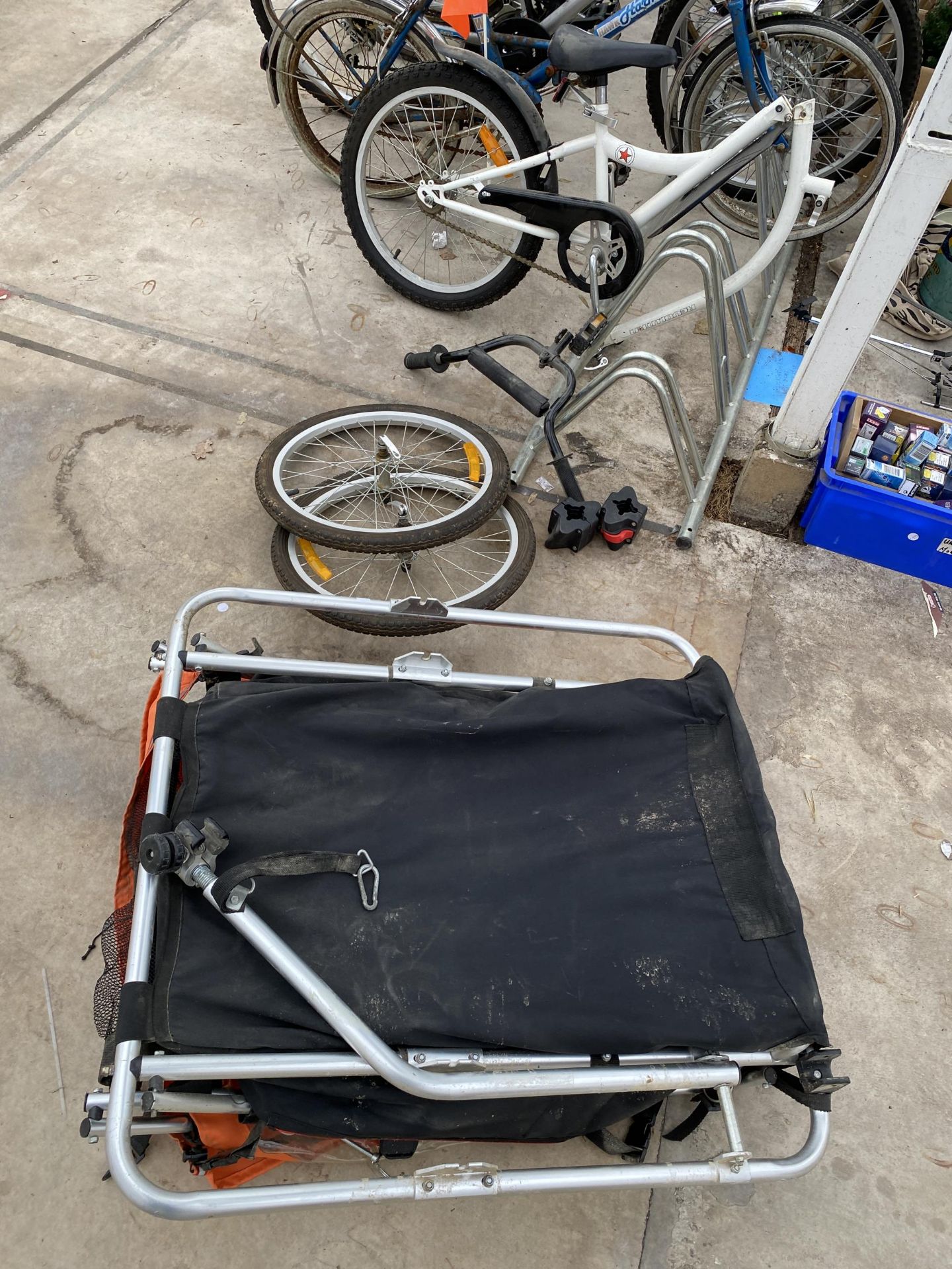 A TWO WHEELED BIKE CARRY TRAILER AND A ACHILDS BIKE ATTATCHMENT