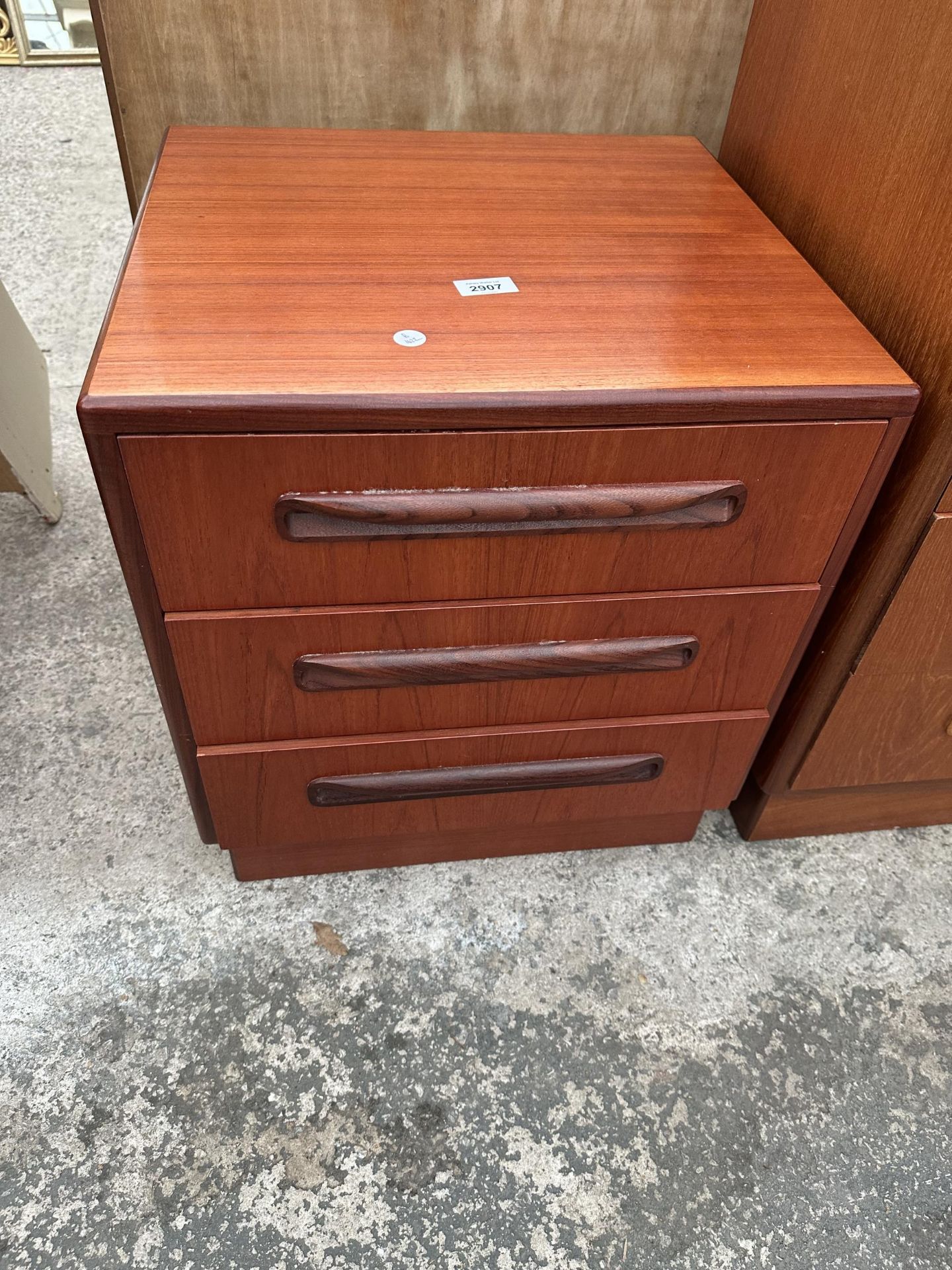 A RETRO TEAK G-PLAN BEDSIDE CHEST OF THREE DRAWERS, 19" WIDE