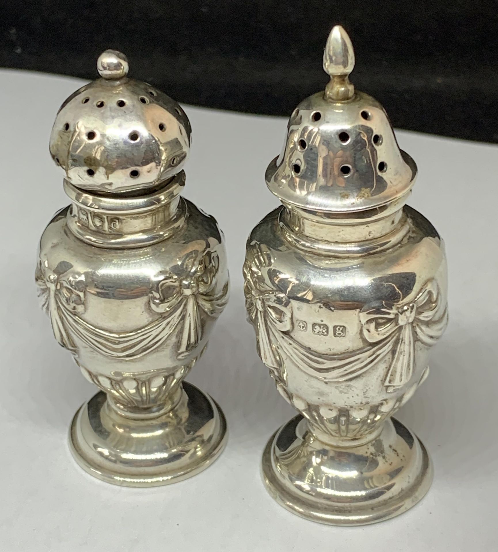 TWO SILVER CRUETS ONE HALLMARKED LONDON THE OTHER BIRMINGHAM