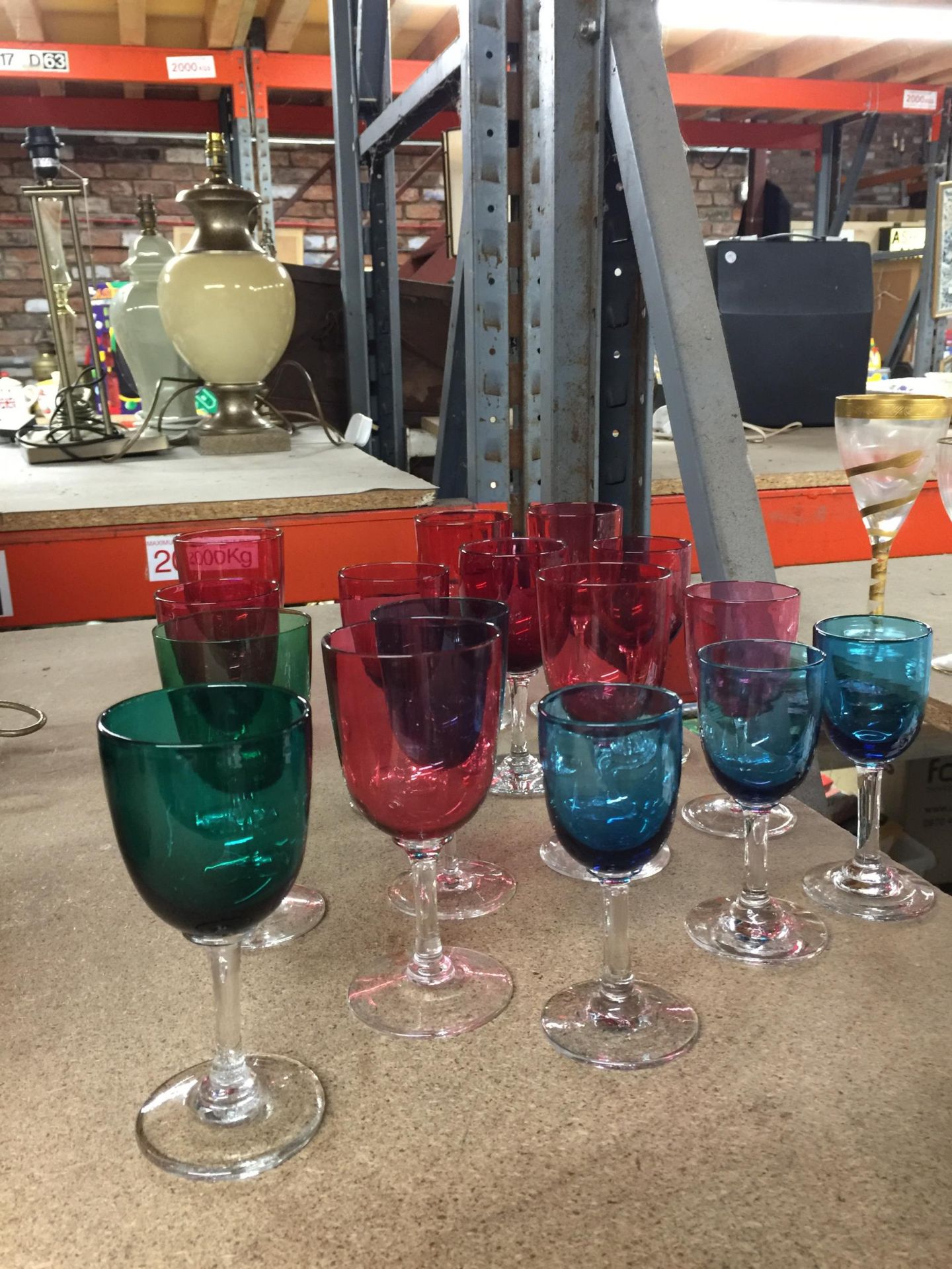 A COLLECTION OF CRANBERRY GLASS DRINKING GLASSES AND FURTHER GLASSES