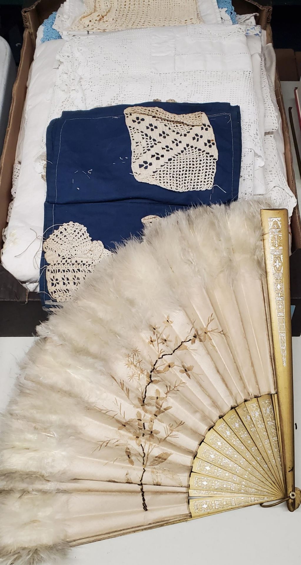 A BOX OF VINTAGE SILK AND AN ORNATE FEATHERED FAN