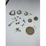 A QUANTITY OF SILVER ITEMS TO INCLUDE TWELVE SINGLE EARRINGS AND TWO LOCKETS
