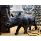 A LARGE HARD WOOD CARVING OF A RHINOCEROUS, HEIGHT 26CM, LENGTH 55CM