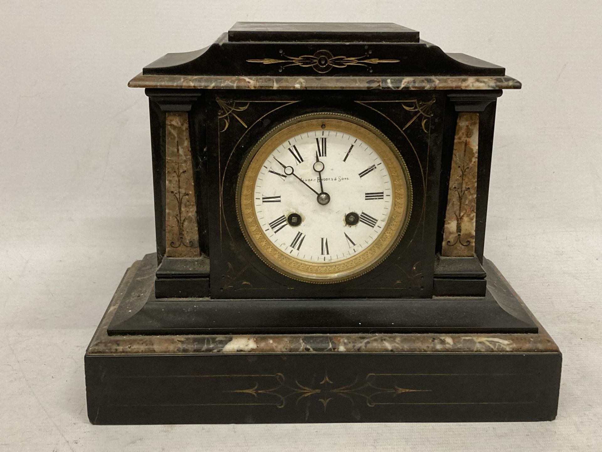 AN ANTIQUE RHODES & SONS BLACK MARBLE SLATE MANTLE CLOCK