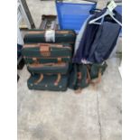 A SET OF FIVE GRADUATED ANTLER TRAVEL CASES AND SOME GENTS CLOTHES