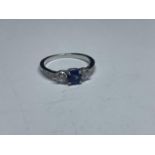 A SWAROVSKI RING WITH BLUE AND CLEAR CRYSTALS WITH LABEL, PRESENTATION BOX AND SLEEVE SIZE K/L