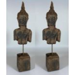 A PAIR OF DECORATIVE STONE BUDDHAS ON PLINTHS, HEIGHT 39CM