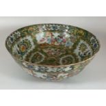 A 19TH CENTURY CHINESE CANTON FAMILLE ROSE MEDALLION PUNCH / FRUIT BOWL WITH FIGURES, BIRDS AND
