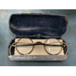 A PAIR OF VICTORIAN TORTOISE SHELL GLASSES IN A WHITE METAL CASE