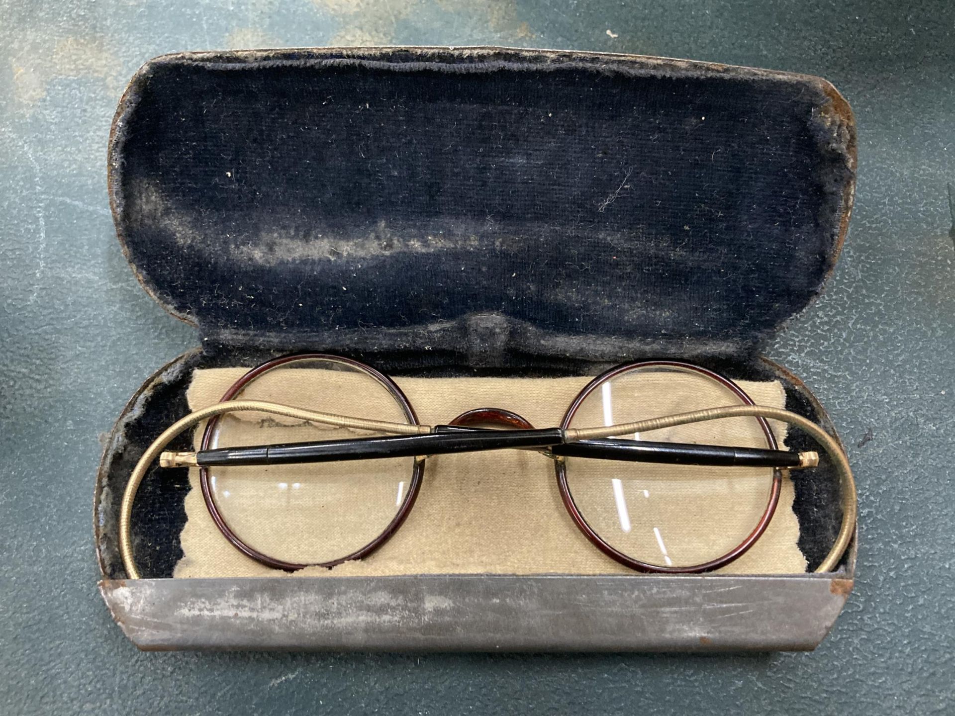 A PAIR OF VICTORIAN TORTOISE SHELL GLASSES IN A WHITE METAL CASE