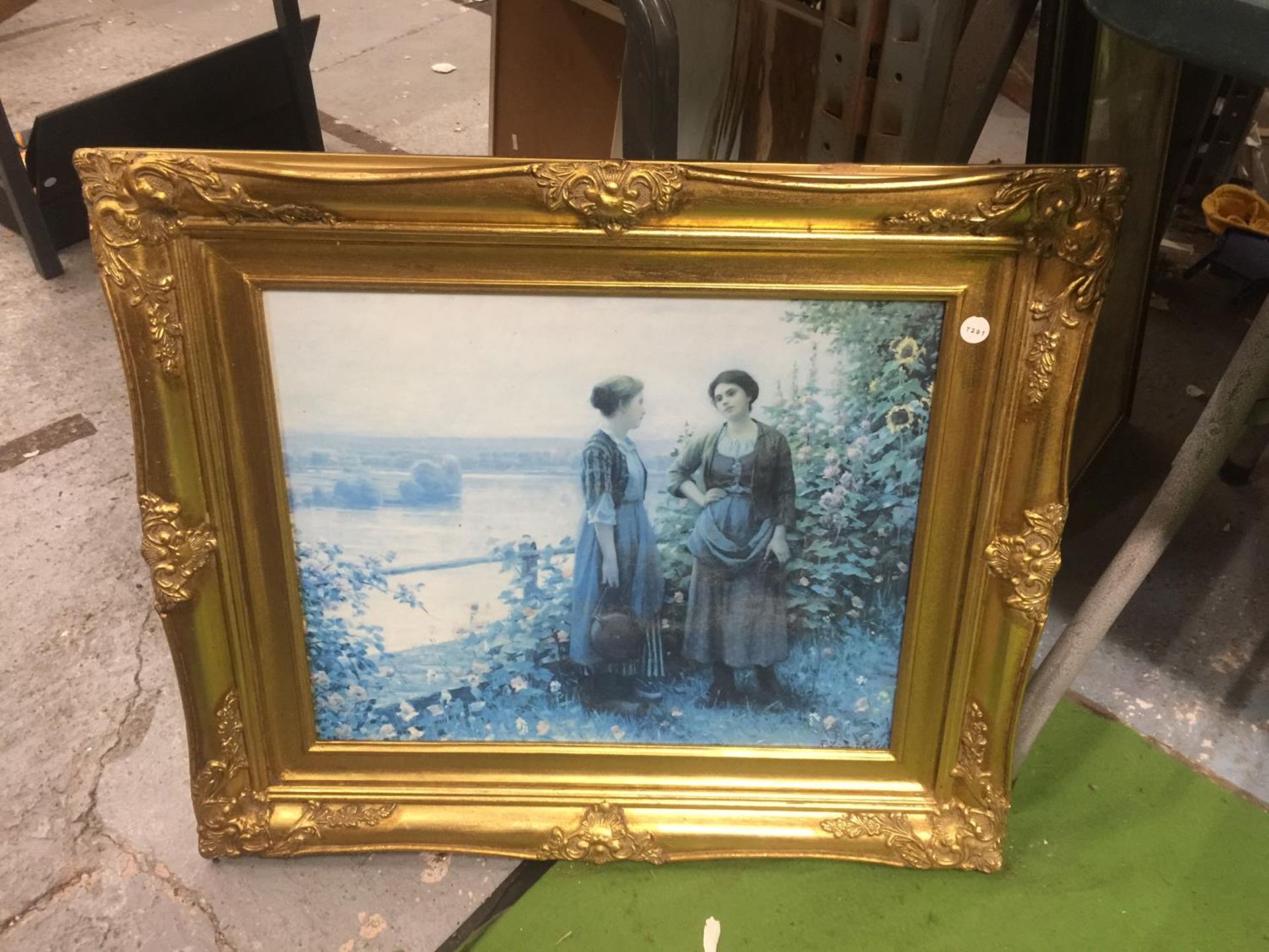 A GILT FRAMED PRINT OF LADIES IN THE COUNTRYSIDE, 69CM X 59CM