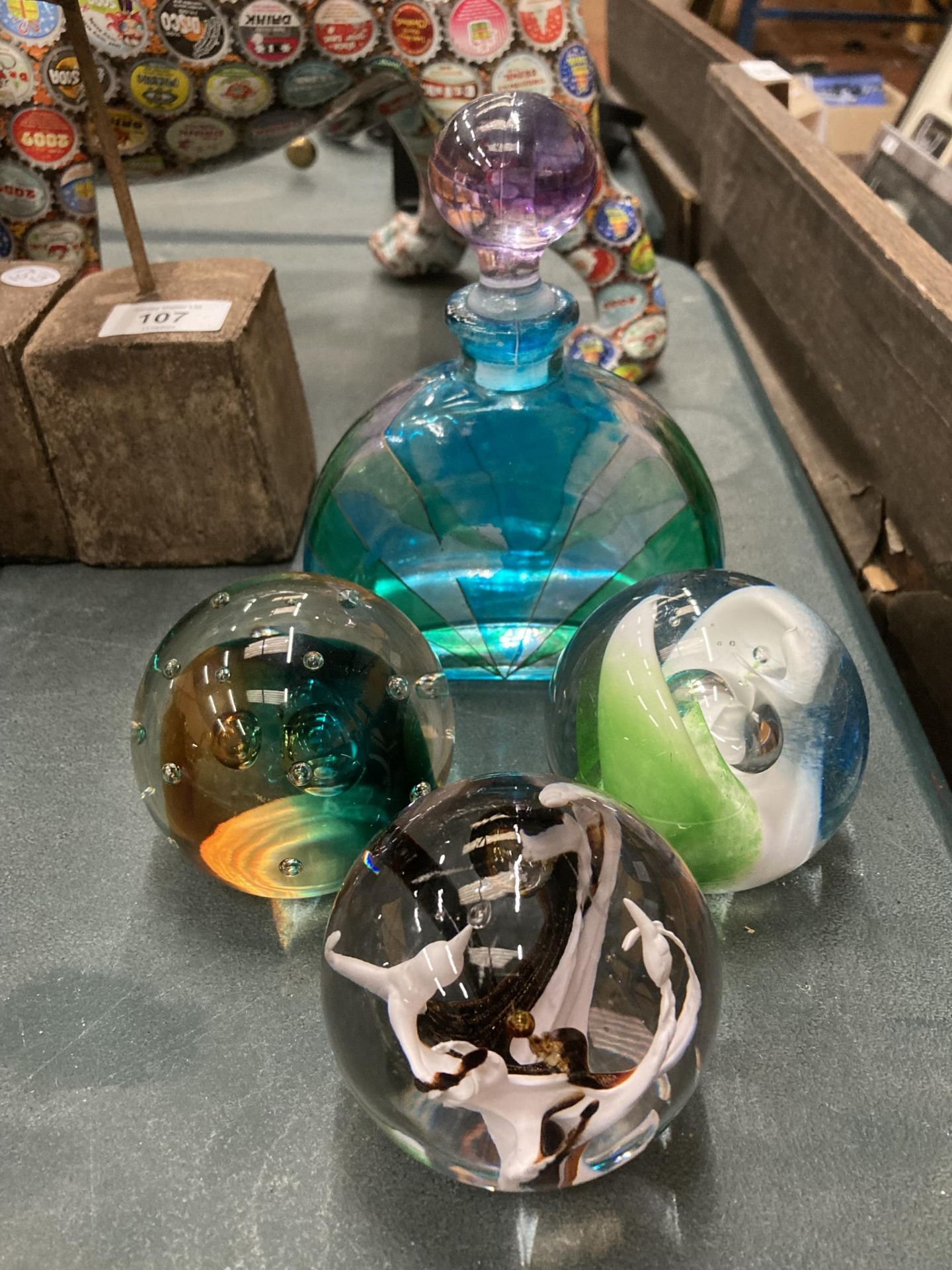 THREE GLASS PAPERWEIGHTS TO INCLUDE A CAITHNESS 'GULF STREAM' PLUS A GLASS SCENT BOTTLE