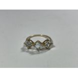 A 10 CARAT GOLD RING WITH THREE IN LINE DIAMOND SHAPED STONES SIZE S