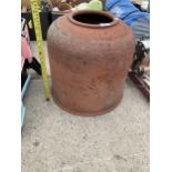 A DECORATIVE TERRACOTTA BELL SHAPED PLANT POT/STAND