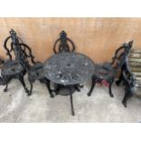 A DECORATIVE CAST ALLOY VICTORIAN STYLE BISTRO SET COMPRISING OF A ROUND TABLE AND FOUR CHAIRS TO
