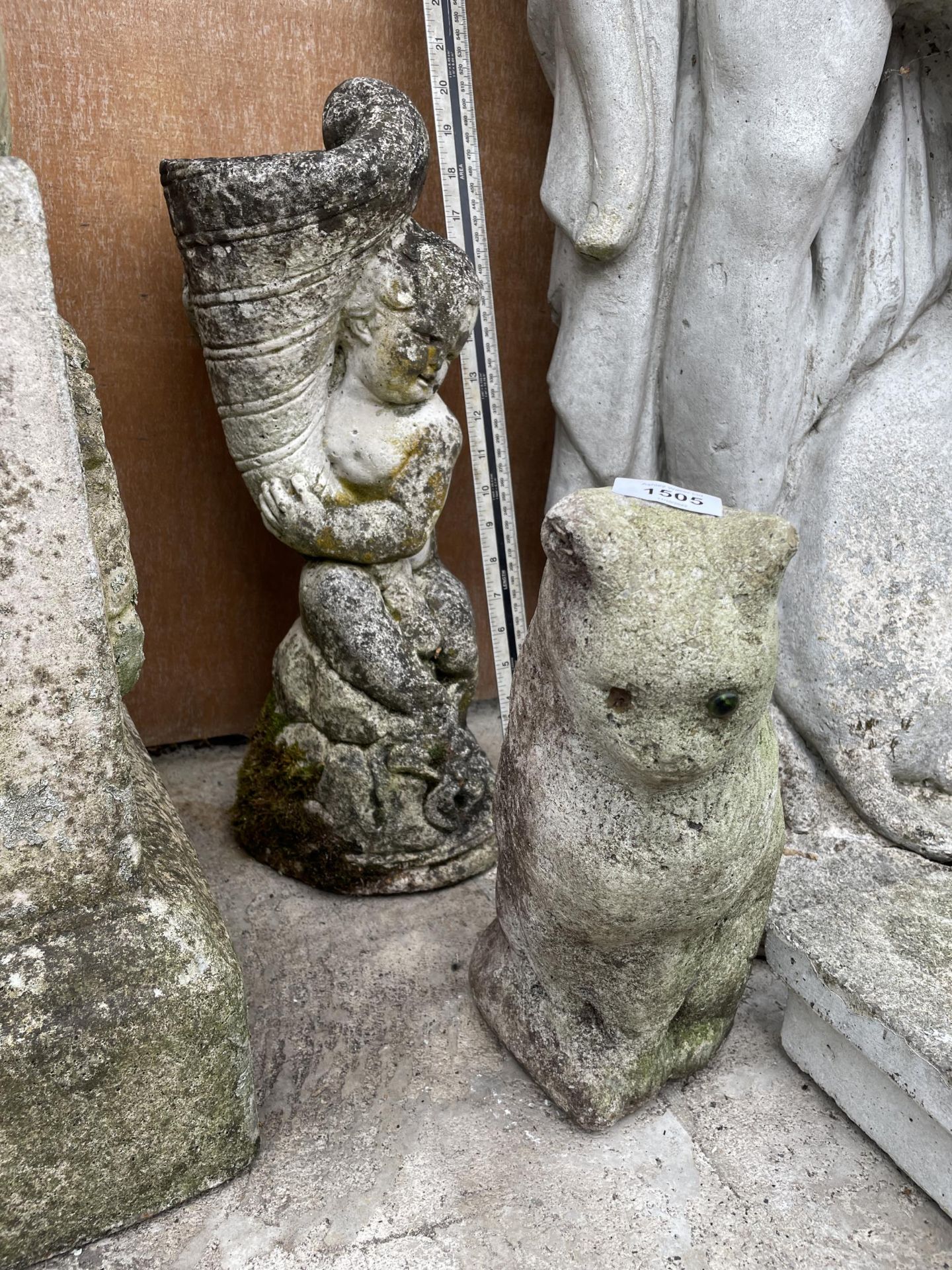 A SMALL RECONSTITTUED STONE CAT AND A CHERUB WATER FEATURE