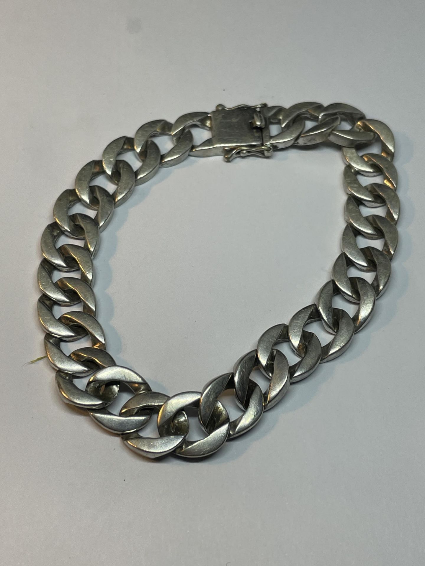 A HEAVY SILVER WRIST CHAIN