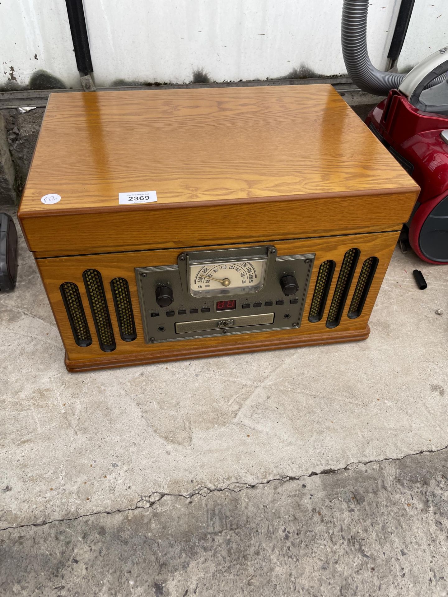 A RETRO ELECTRIC PORTABLE RECORD PLAYER