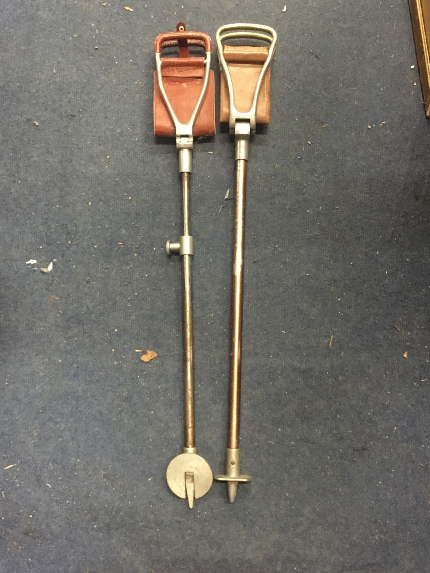 TWO VINTAGE SHOOTING STICKS WITH LEATHER SEATS