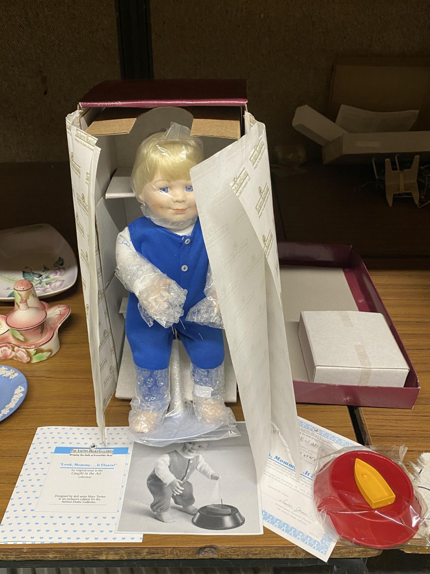 AN ASHTON DRAKE GALLERIES PORCELAIN 'LOOK MOMMY IT FLOATS' DOLL WITH BOX AND CERTIFICATE