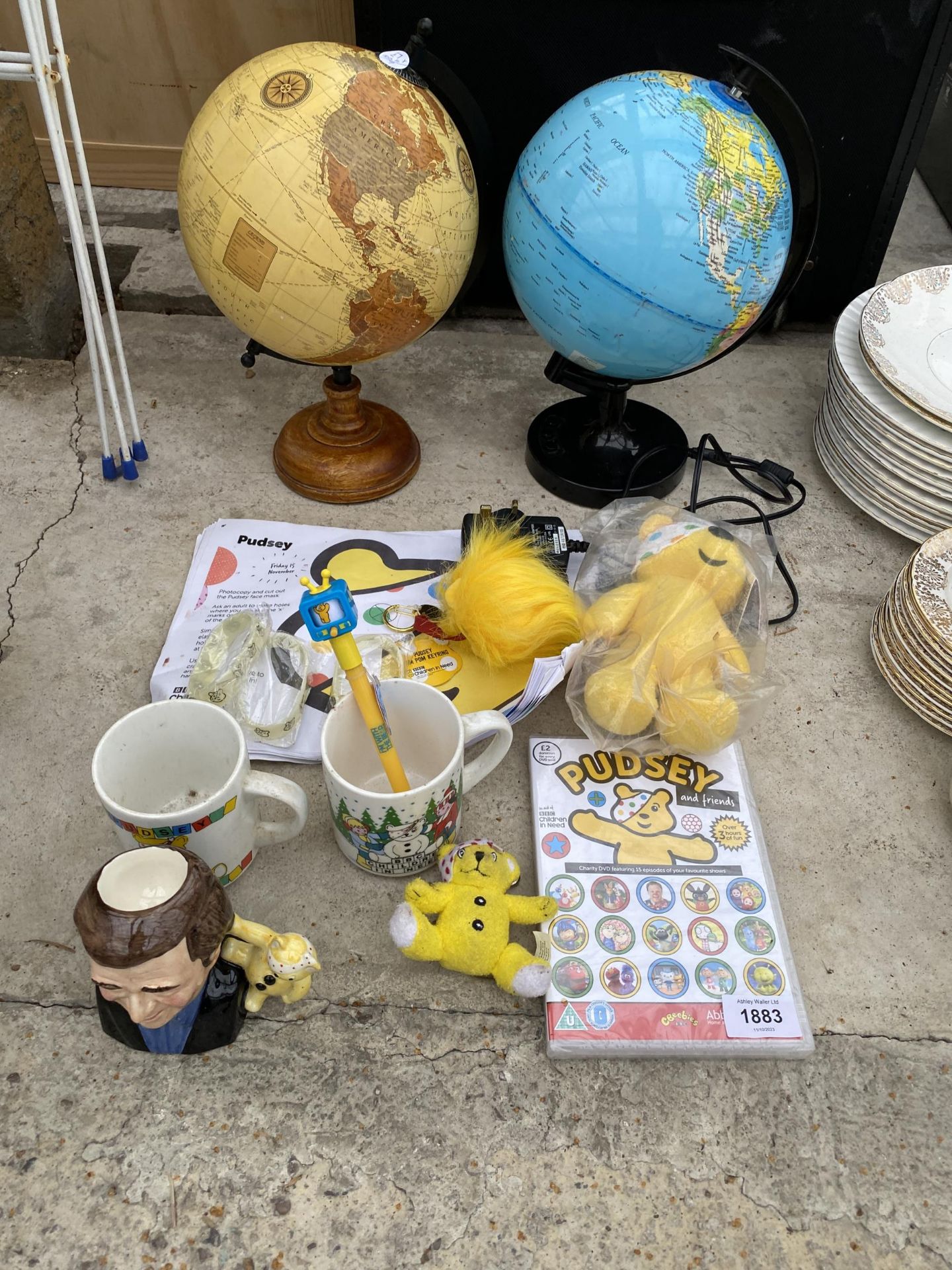 TWO GLOBES AND AN ASSORTMENT OF PUDSEY BEAR ITEMS ETC