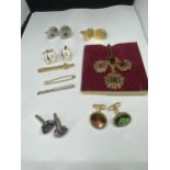 A COLLECTION OF CUFF LINKS AND TIE PINS