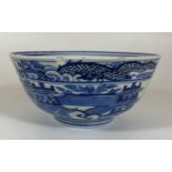 A LATE 19TH CENTURY CHINESE KANGXI REVIVAL BLUE AND WHITE PORCELAIN BOWL WITH DRAGON IN THE CLOUDS