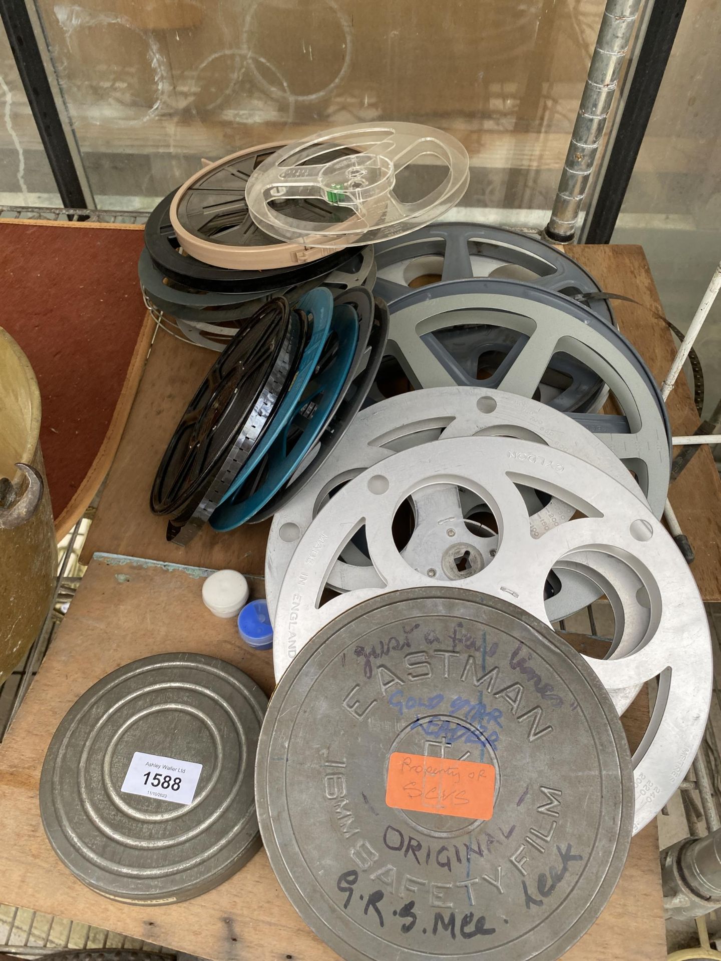 AN ASSORTMENT OF CINE REELS AND REEL HOLDERS