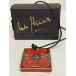 AN ANITA HARRIS HAND PAINTED AND SIGNED IN GOLD POPPY PENDANT NECKLACE IN A PRESENTATION BOX