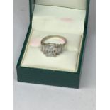 A 9 CARAT WHITE GOLD RING WITH FIVE RECTANGULAR CUBIC ZIRCONIAS SIZE K/L IN A PRESENTATION BOX