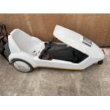 A SINCLAIR C5 COMPLETE WITH KEY, CHARGER AND OWNERS HANDBOOK