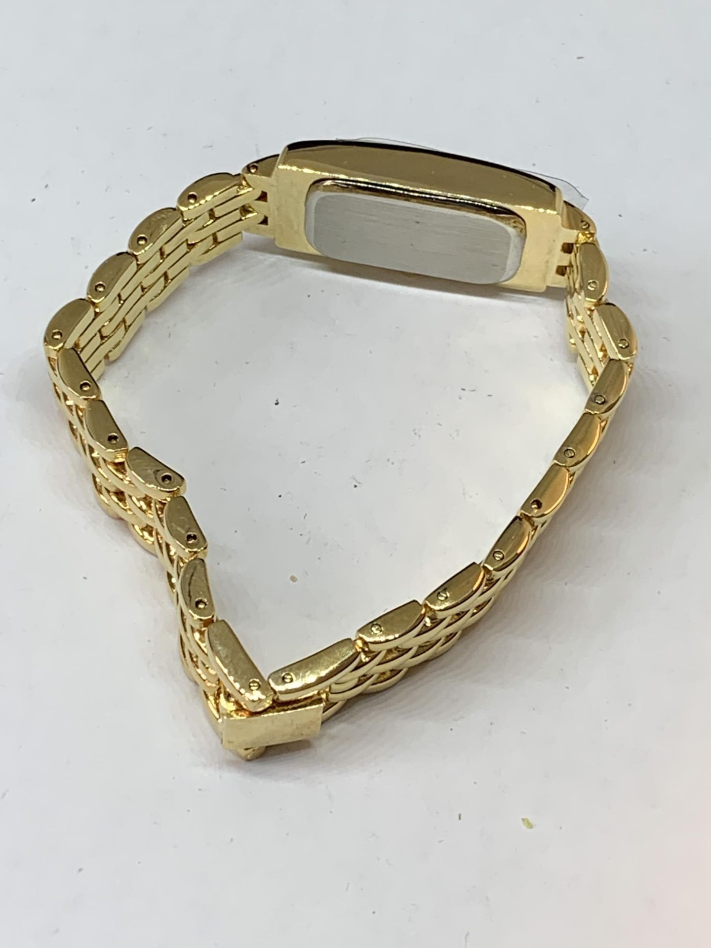 A YELLOW METAL WRIST WATCH WITH RECTANGULAR FACE SEEN WORKING BUT NO WARRANTY - Image 3 of 3