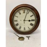 A VINTAGE OAK CASED RAILWAY CLOCK WITH PENDULUM AND KEY