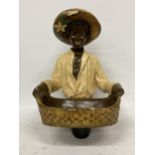 A VINTAGE CHALKWARE FIGURE OF A LADY HOLDING A BASKET