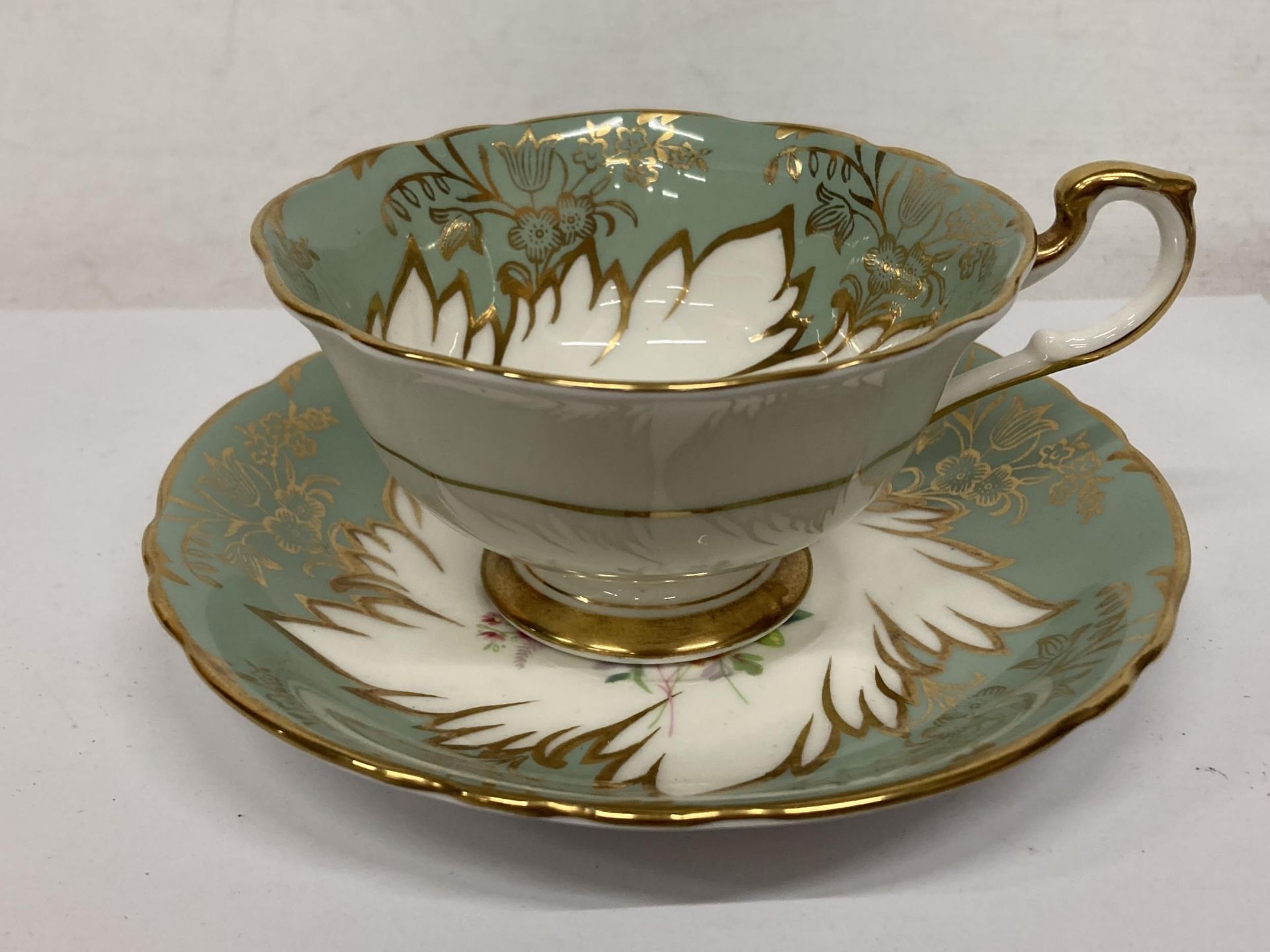 A PARAGON FOOTED TEACUP AND SAUCER GREEN WITH GOLD GILT AND FLORAL SPRAYS - Image 2 of 4