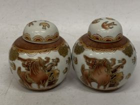 A PAIR OF JAPANESE KUTANI STYLE GINGER JARS AND COVERS