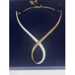 A SWAROVSKI CRYSTAL TWIST NECKLACE WITH CERTIFICATE IN A PRESENTATION BOX WITH SLEEVE COVER