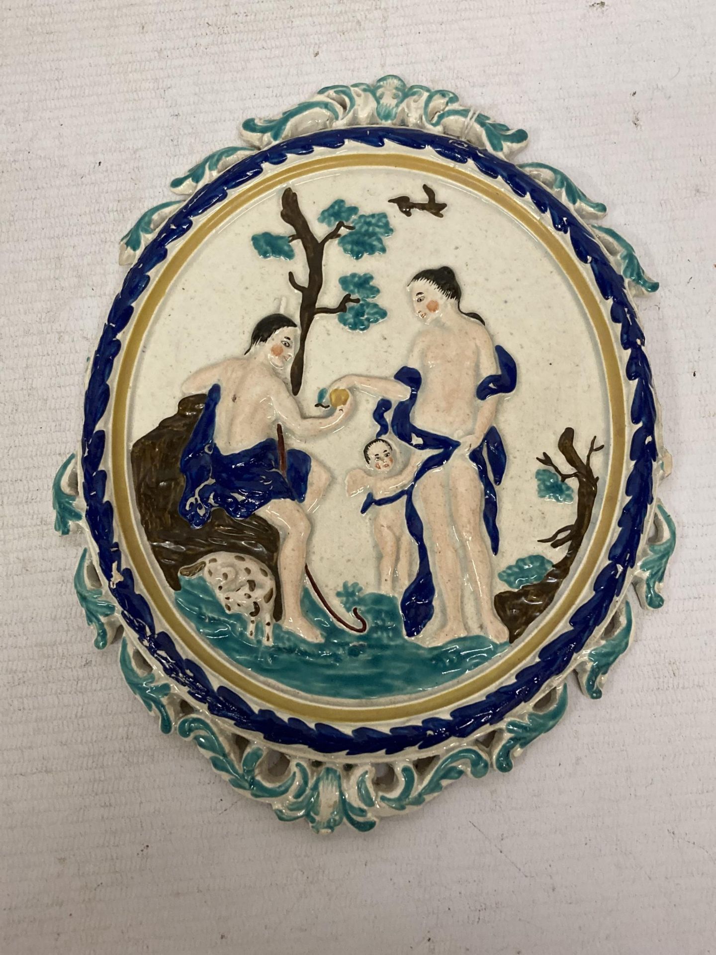 A POSSIBLY 19TH CENTURY MAJOLICA STYLE CERAMIC PLAQUE WITH FIGURAL SCENE, (DAMAGE TO EDGES)