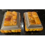 A PAIR OF VINTAGE, BELIEVED YELLOW AMBER, TRINKET BOXES WITH WHITE METAL BORDER AND BASES